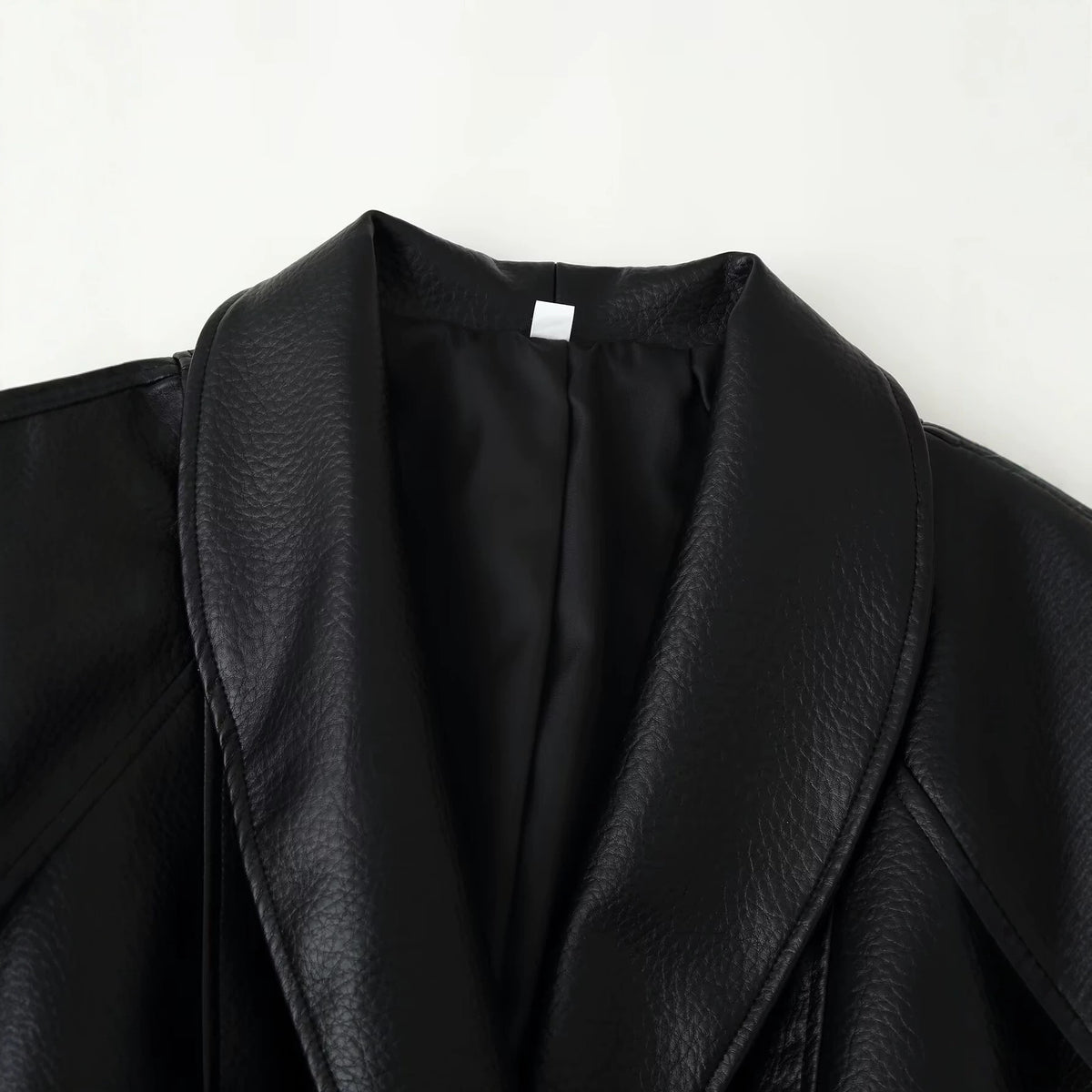 Wearing a PU leather jacket with a belt for women